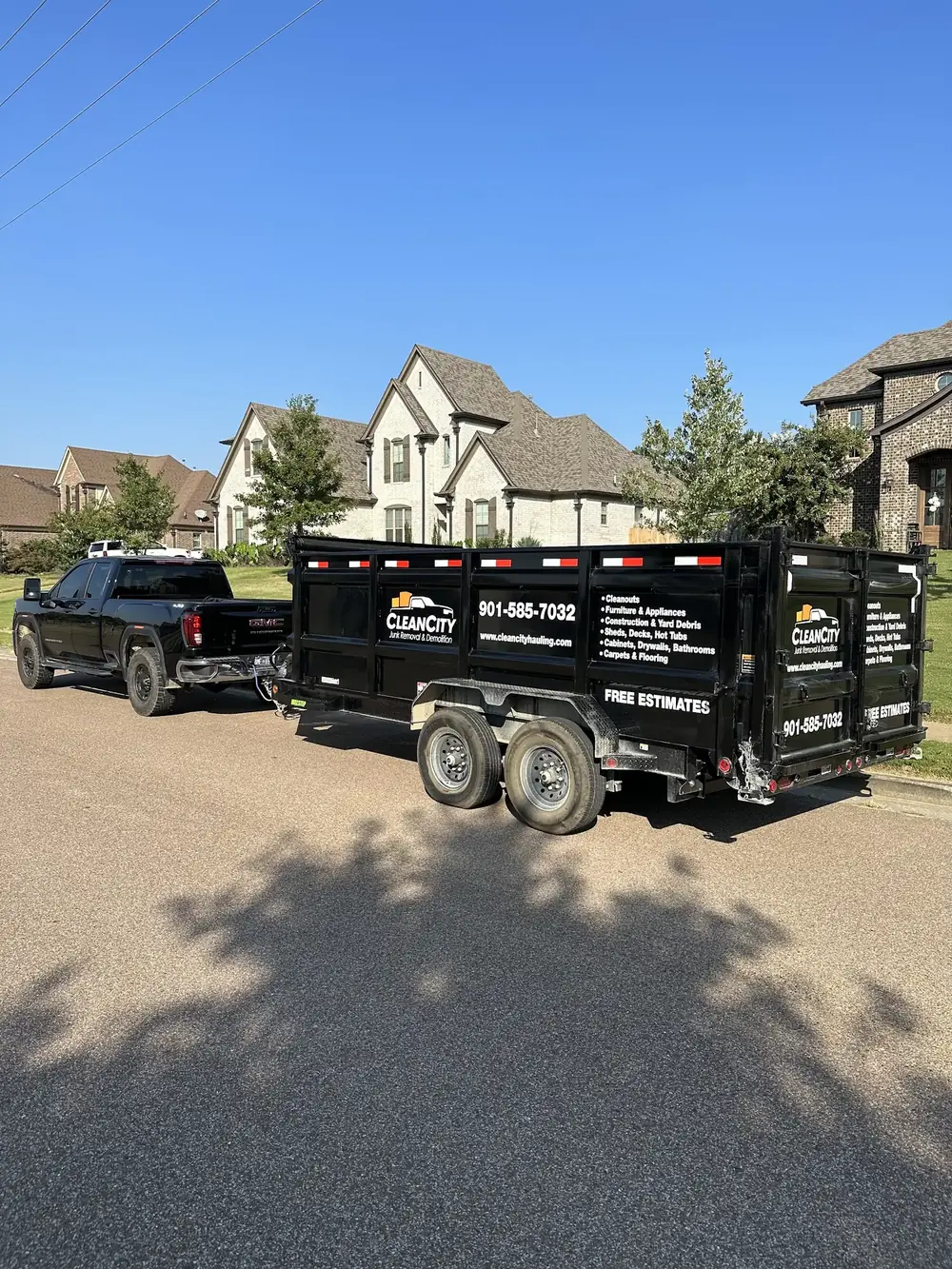 Clean City dump trailer and truck in a Memphis-area neighborhood