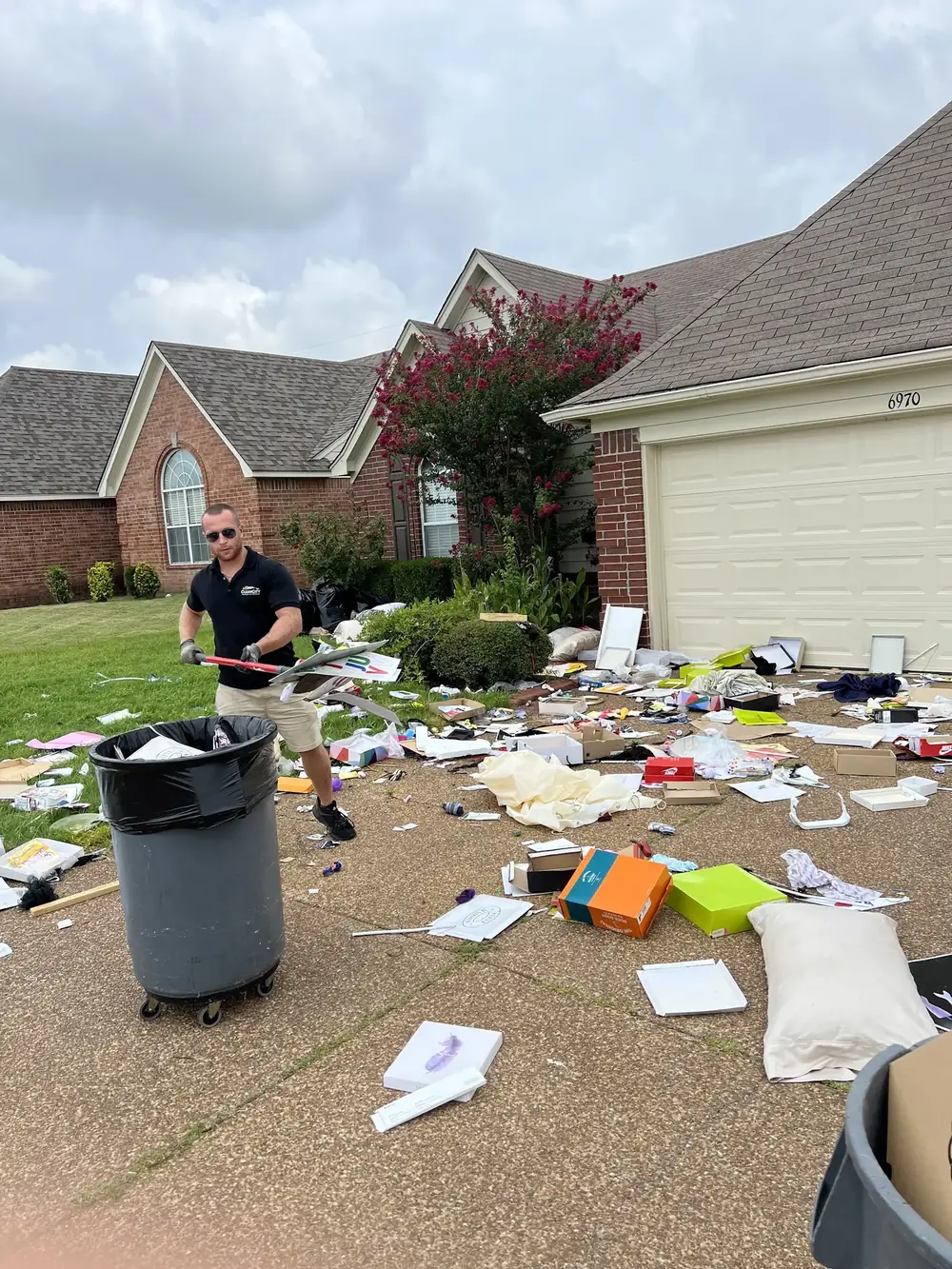 A front yard covered in belongings left after an eviction
