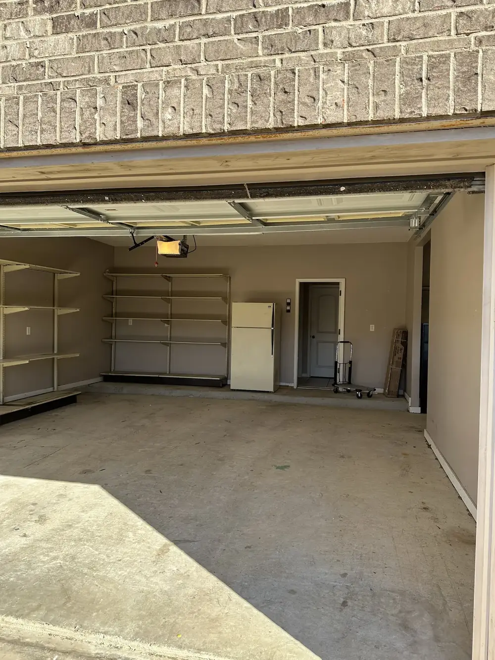 After: the same garage emptied and swept