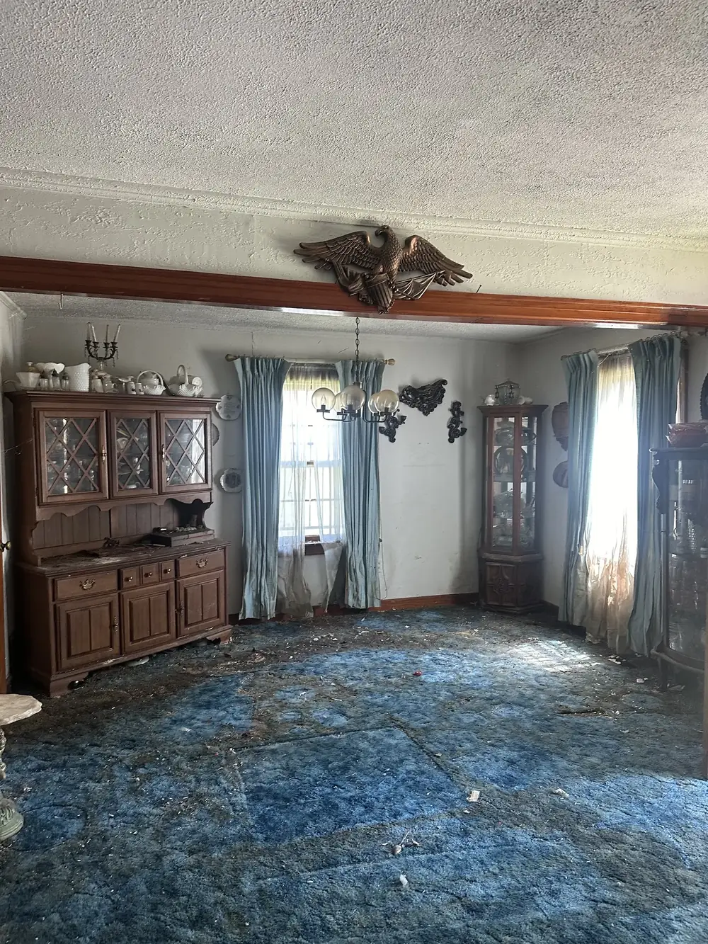 After: the same dining room cleared down to the carpet
